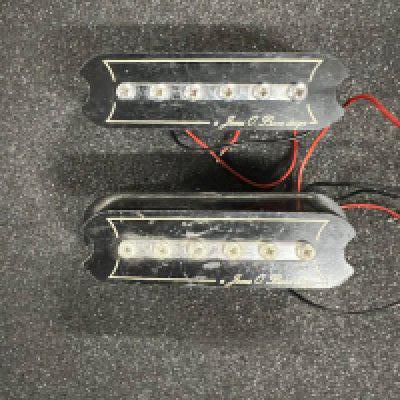 A pair of James O' Burns pickups from the late 1960's. One is intact the other is missing the base and some damage to casing - otherwise fine.