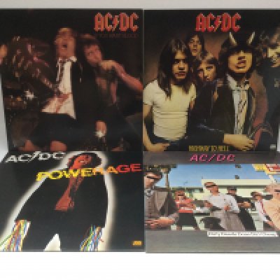 Four AC/DC LPs comprising 'Highway To Hell', 'Powerage', 'If You Want Blood' and 'Dirty Deeds Done Dirt Cheap'.