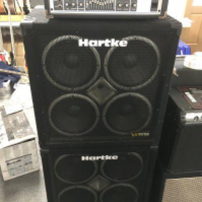 A Hartke HA5500 bass amp head and a pair of Hartke VX410 bass amp cabinets (3). Comes with a hard carry case for the head.