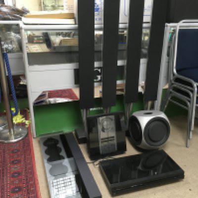 A collection of Bang & Olufsen music centre items with two pairs of speakers, sub bass speaker and manuals.