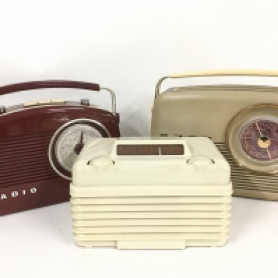 Five vintage and modern radios including Bush and Champion examples.