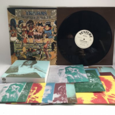 A Bob Marley limited edition 7" singles and multi CD box set plus a signed Sharon Peters 12" single and a Trojan records 'Greatest Hits' LP (3).