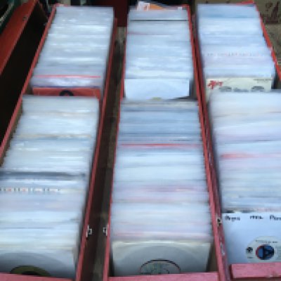 Three long boxes of 700 plus 7" singles by various artists from the 1960s onwards.p including some promo discs.