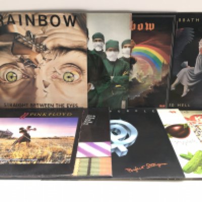 Two bags containing 18 rock and prog rock LPs by various artists including The Who, Pink Floyd, Black Sabbath, Rainbow, Yes and others plus an empty sleeve for 'Long Live Rock & Roll'.