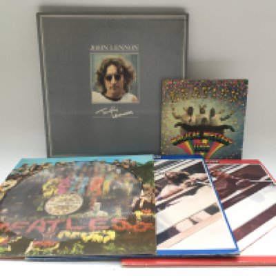 A John Lennon 8LP box set, a 'Magical Mystery Tour' EP, a 'Sgt Pepper' picture disc and the red and blue albums. Please note the box set is badly worn to the reverse of the packaging.