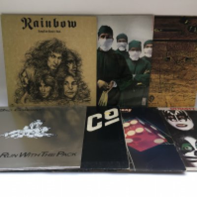 Fifteen heavy rock LPs by various artists including Rainbow, AC/DC, Alice Cooper, Kiss and others.
