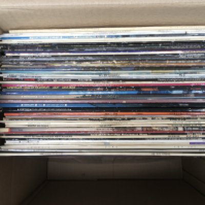 A box of LPs by various artists including a Portuguese pressing of 'Abbey Road' plus albums by Thin Lizzy, Pat Benatar, 10CC and others.