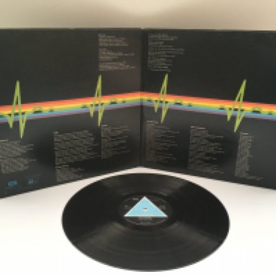 A first UK pressing of 'Dark Side Of The Moon' by Pink Floyd with solid blue triangle labels and complete with all inserts, EX/VG+.