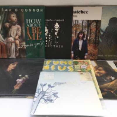 Two bags containing 17 indie rock and pop LPs and 12" singles by various artists including Joan As Police Woman, Matt Berry, Jack Johnson and others. Includes original and 180g pressings.