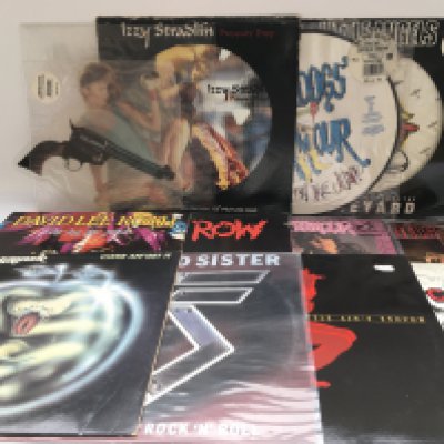 A collection of heavy rock and metal LPs and 12" singles by various artists including AC/DC, Motorhead, Skid Row, Motley Crue and others. Includes some picture discs.