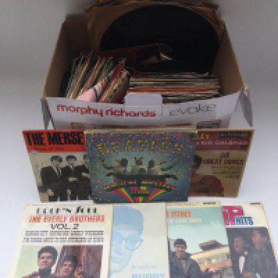 A box of 7" singles, EPs and 78s by various artists including Elvis Presley, The Beatles, Jerry Lee Lewis and many more.