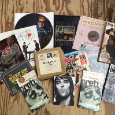 Two boxes of CDs, tour programs, CD long box sets, a signed Ray Charles publicity photo etc.