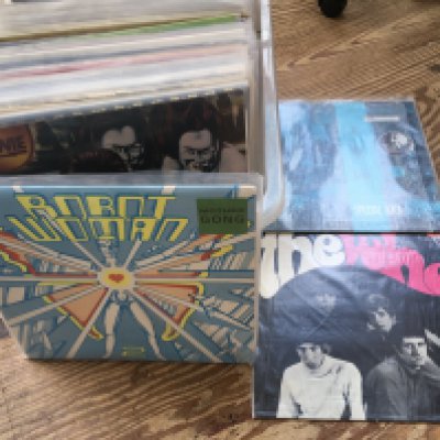 A box of LPs and 12" singles by various artists including David Bowie, Hawkwind, The Who, Jesus And Mary Chain and others.