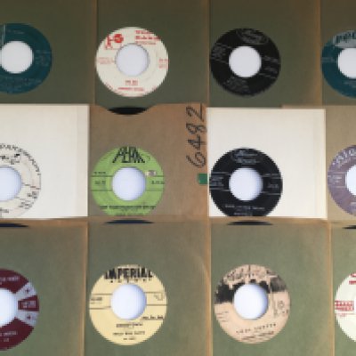 A collection of approx 24 US pressings of 7" singles by various artists including Sam Cooke, Willie Nelson and others. Includes promotional discs.