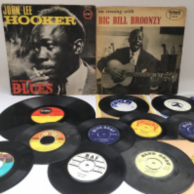 A John Lee Hooker 'Sings Blues' LP test pressing, a Big Bill Broonzy LP and some Jamaican pressings of reggae and ska 7" singles by various artists including Bob Marley, Prince Buster and others.