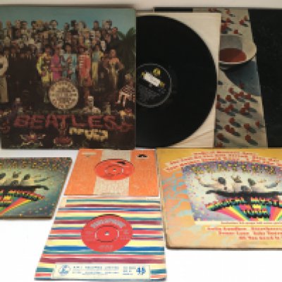 A small collection of Beatles and related 7" singles, EP and LPs comprising a first UK pressing of 'Love Me Do', one small feelable scratch, 'Ain't She Sweet' on Polydor and others.