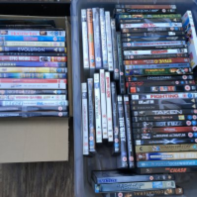 Four boxes of CDs and DVDs.