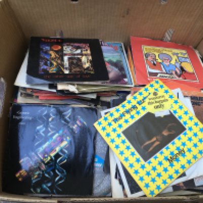 A box of 7" singles by various artists including OMD, Yazoo, XTC and many more.