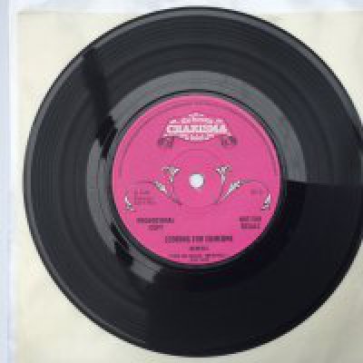 A rare Genesis promotional disc of 'Looking For Someone' b/w 'Visions Of Angels' given away to radio stations and members of the press to promote the 1970 'Trespass' LP. Solid centre with rough textured pink scroll Charisma labels. Matrices 65+1+1 and 65+2+1. Hard to find in such exceptional condition.