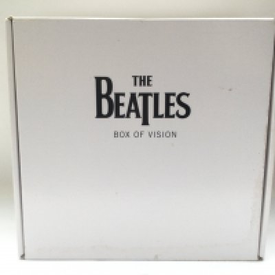 A Beatles 'Box Of Vision' multi CD storage with CDs and hardback book.