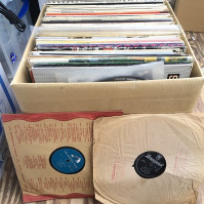 A box of LPs, 12" singles and 78s by various artists including Marc Bolan, Ian Anderson, Madonna and others.