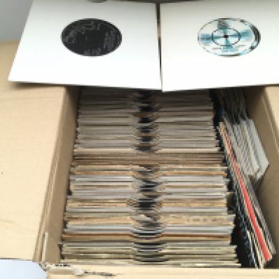 A box of Motown 7" singles by various artists from the 1960s onwards.