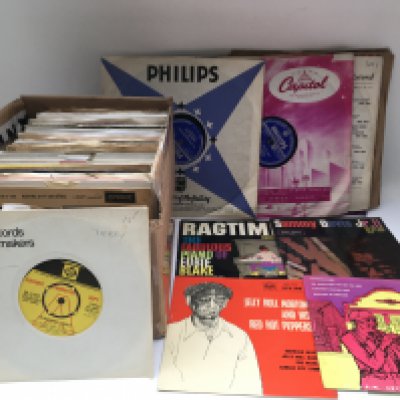A box of jazz 78s and 7" singles by various artists including Jelly Roll Morton, Bunk Johnson and many more.