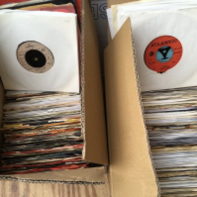 Four small boxes of 7" singles by various artists from the 1970s onwards.