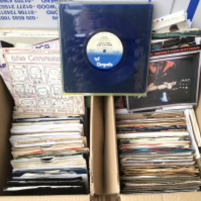 Four small boxes of 7" singles by various artists from the 1980s onwards.