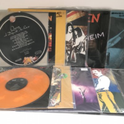 A box of Queen and related LPs and 12" singles including coloured vinyl and foreign pressings.