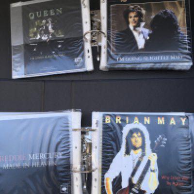 A box containing seven binders of exclusive edition Queen Fanclub only 7" singles.