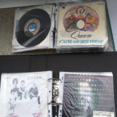 A box containing four binders of Queen 7" singles comprising European pressings and imports.