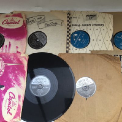 A small collection of 78s by various artists including Elvis Presley, Gene Vincent, Little Richard and others.