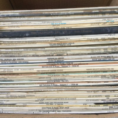 A box of jazz LPs by various artists including Coleman Hawkins, Lester Young, Duke Ellington and others including two Jack Teagarden test pressing LPs.