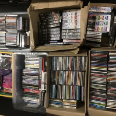 A large collection of CDs, DVDs and VHS tapes including some box sets.
