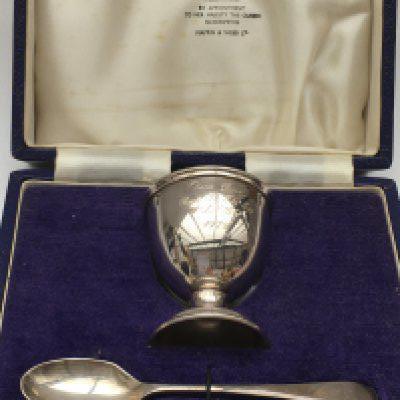 Wings / Paul McCartney interest. A rare cased silver egg cup by Mappin & Webb presented to Barry, the lead cameraman on a video shoot at Lympne Castle, Kent in 1979. This lot comes with accompanying photographs taken on one of the day's filming.