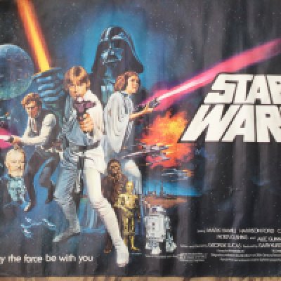 A circa 1978 Star Wars movie program and ticket plus a poster purchased around the time of the screening. Poster measures approx 100cm x 75.5cm.