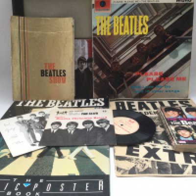 A collection of Beatles ephemera including a 1963 Beatles show tour program (the cover has separated from the rest of the book), 'Another Beatles Christmas Record' flexi disc, an early UK pressing of the 'Please Please Me' LP (not black and gold labels) and other items.