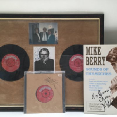 A framed and signed display of Adam Faith plus a signed Mike Berry LP. No COAs. Please note that buyers must satisfy themselves as to the authenticity of any signed items before bidding as we are not experts in this field and will not be held responsible should they prove to be anything other than genuine.
