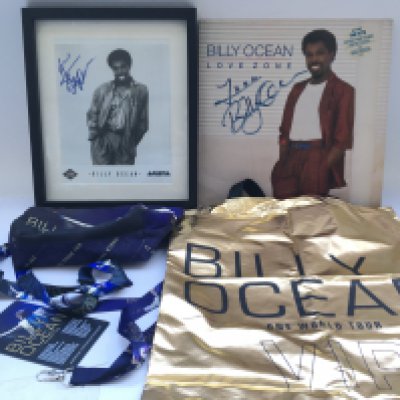 A collection of Billy Ocean memorabilia comprising a signed publicity print and 12" record plus world tour ephemera.