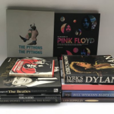A collection of music and film related books and tour programs comprising a Monty Python autobiography, 'Remember' by Michael McCartney, Rolling Stones 'A Life On The Road' and others.