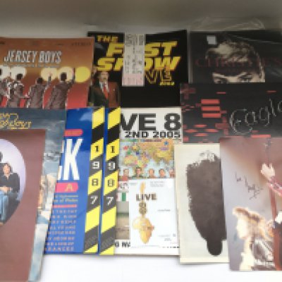A box of music and theatre programs plus a signed Bill Wyman print, Christie's film and entertainment catalogues etc.