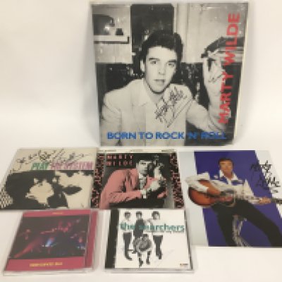 A Marty Wilde signed LP 'Born To Rock n Roll', a signed publicity photo and an EP plus a signed EP by The Searchers and two further signed CDs.