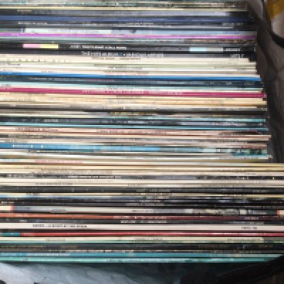 A bag of LPs by various artists including Queen, Meat Loaf, Bob Marley and others.