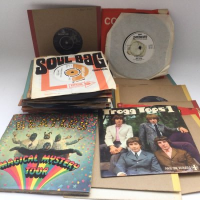 A collection of 7" singles and EPs by artists from the 1960s including The Beatles, Small Faces, The Animals and others.