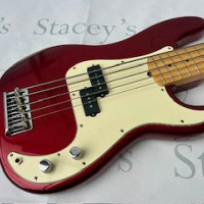 A 2009 Corona California 5 String Precision Bass Guitar in Candy Apple Red with maple fingerboard and chrome parts. All original with very little evidence of any playwear or tarnishing to chrome brightwork. Cream aged pickguard. Comes with non original Yamaha bass guitar hard case.