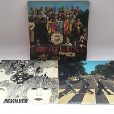 Three early UK pressings of Beatles LPs comprising 'Sgt Pepper', 'Revolver' and 'Abbey Road'. All have at least one feelable scratch.