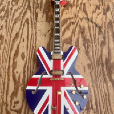 A 1998 Epiphone Sheraton First Run Dot Union Jack Electric Guitar forerunner of the Noel Gallagher Supernova in unplayed condition with hang tags, plastic still on pickup certificate of authenticity and Epiphone grey small logo case.