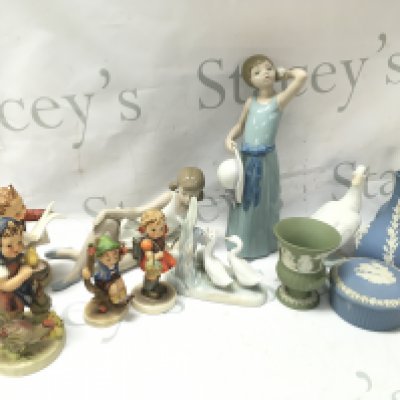 A collection of ceramic figures including Lladro, Hummel, Wedgwood vases and a trinket box . This lot cannot be posted. NO RESERVE