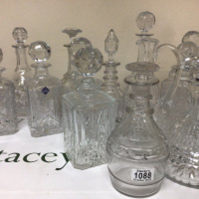 A good collection of cut glass decanters including a late George III decanter with a mushroom. Edinburgh Crystal and many others. NO RESERVE